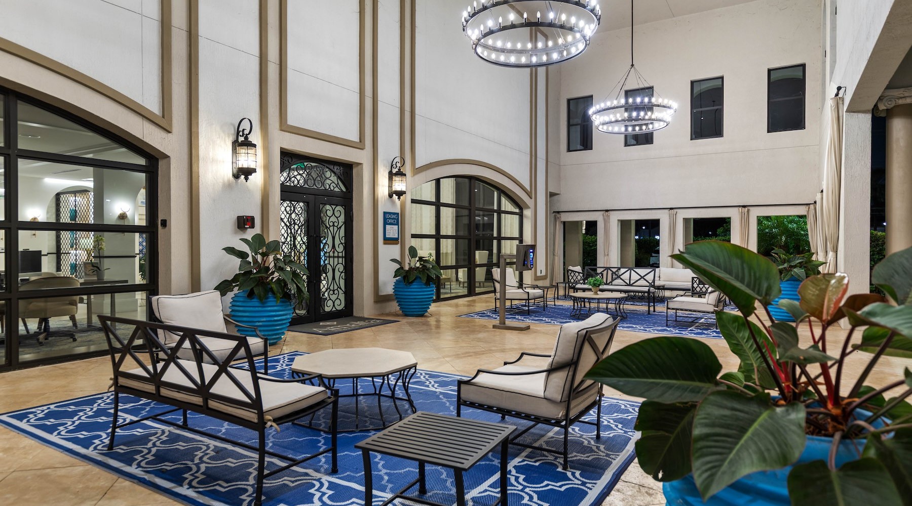 a clubroom with couches, tables and chairs