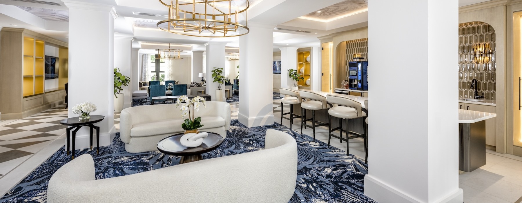 a clubroom with couches, tables and chairs