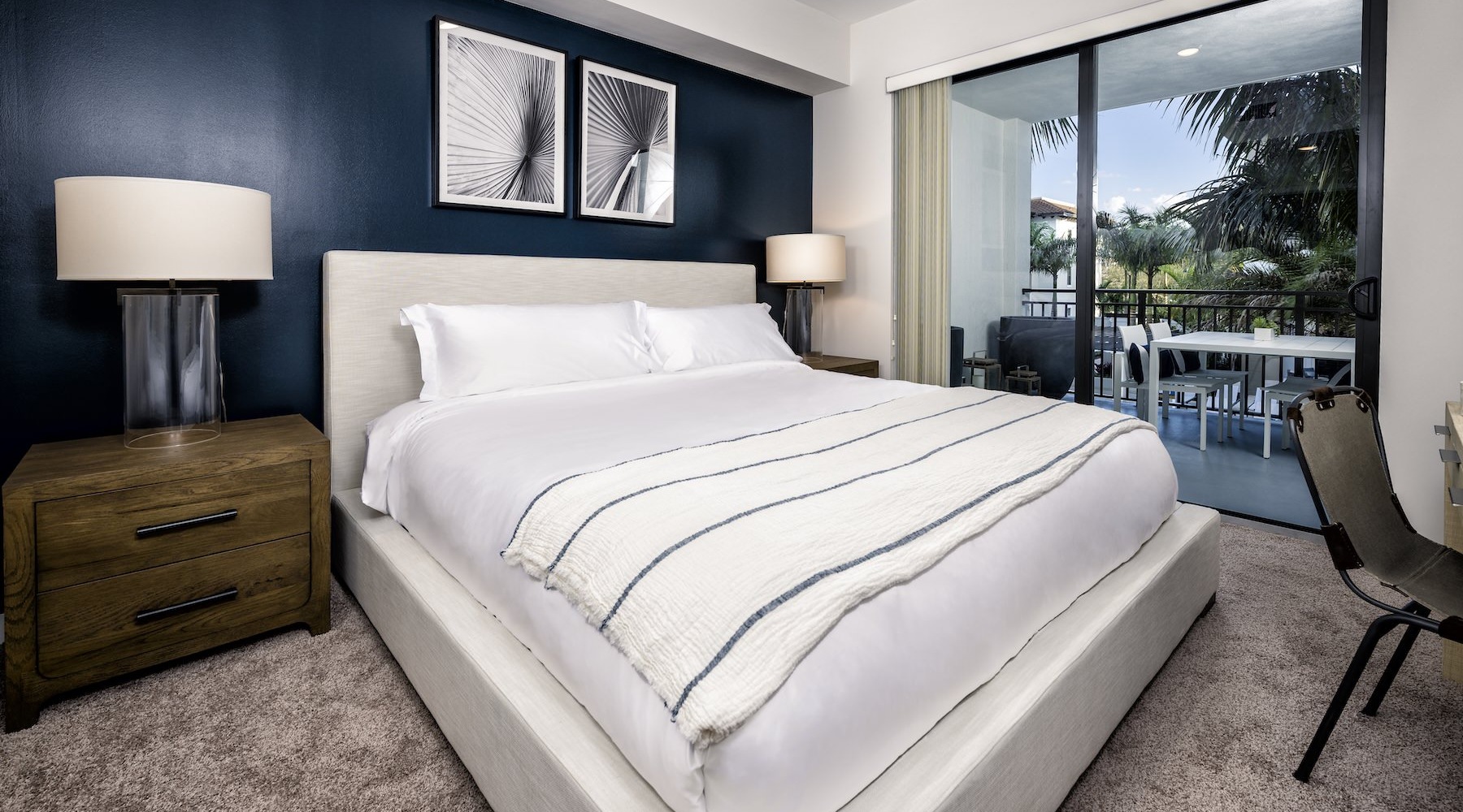 a bedroom with a bed and two nightstands